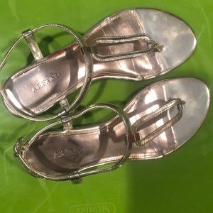 Briefly worn silver sandals